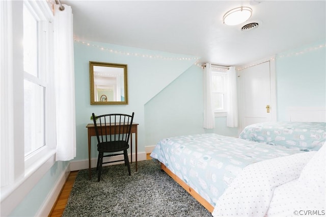 bedroom with hardwood / wood-style floors