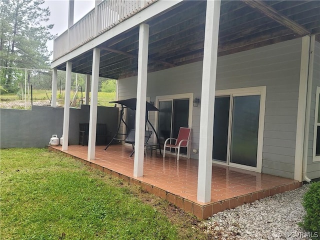 wooden deck featuring a lawn