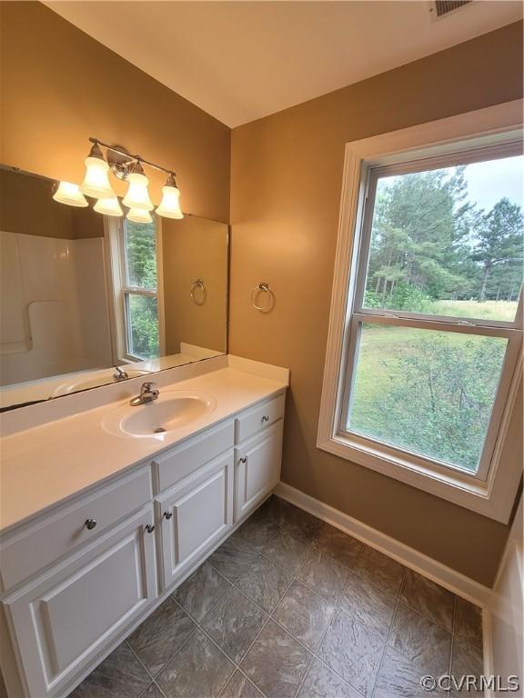 bathroom featuring vanity and an inviting chandelier