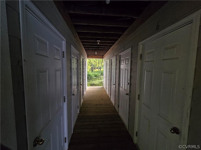 hallway with wood-type flooring