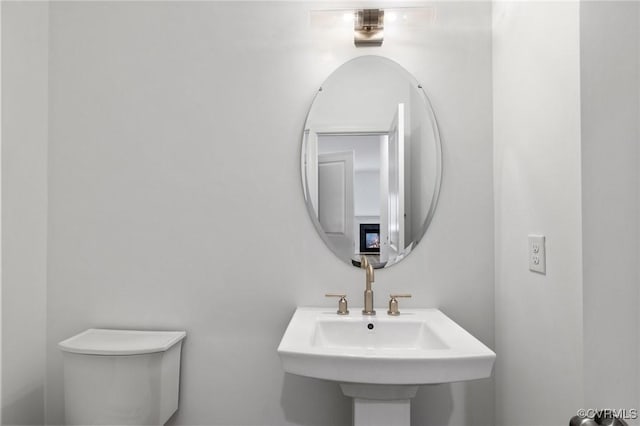 bathroom with sink and toilet