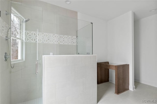 bathroom featuring walk in shower and plenty of natural light