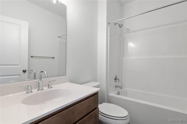 full bathroom featuring  shower combination, vanity, and toilet