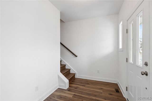 foyer with dark hardwood / wood-style flooring