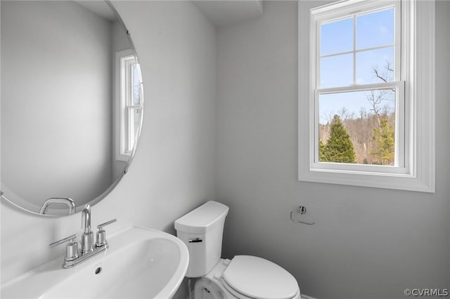 bathroom with toilet and sink