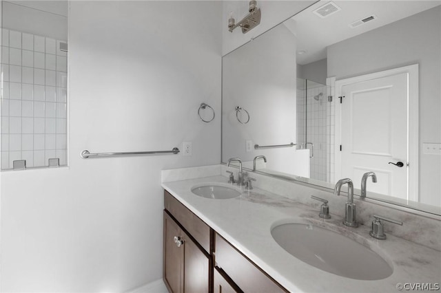 bathroom with vanity and an enclosed shower