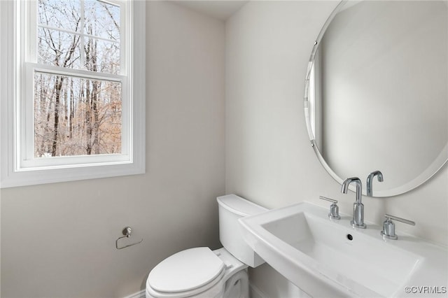 bathroom with sink and toilet