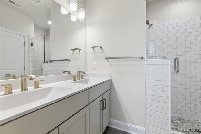 bathroom featuring vanity and a shower with door