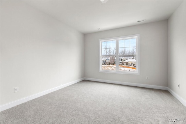 unfurnished room with carpet floors