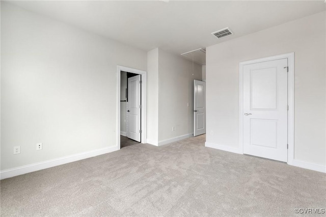 unfurnished bedroom with light colored carpet