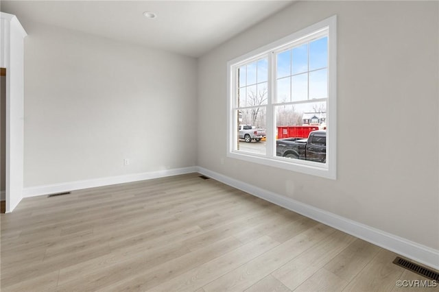 unfurnished room featuring light hardwood / wood-style floors