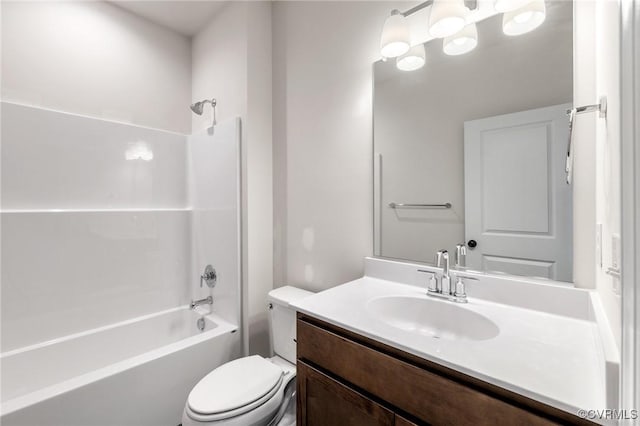 full bathroom with toilet, vanity, and washtub / shower combination