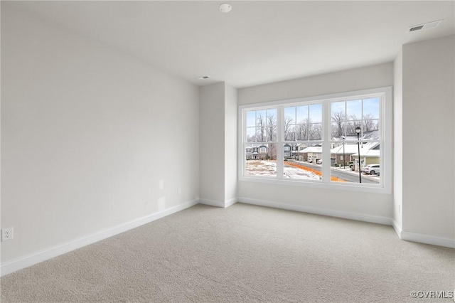 empty room featuring carpet flooring