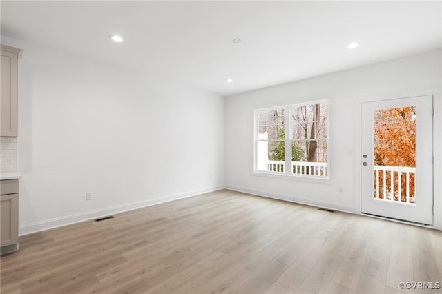 unfurnished living room featuring light hardwood / wood-style floors