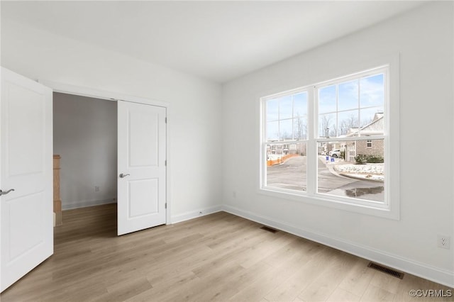 unfurnished bedroom featuring light hardwood / wood-style floors