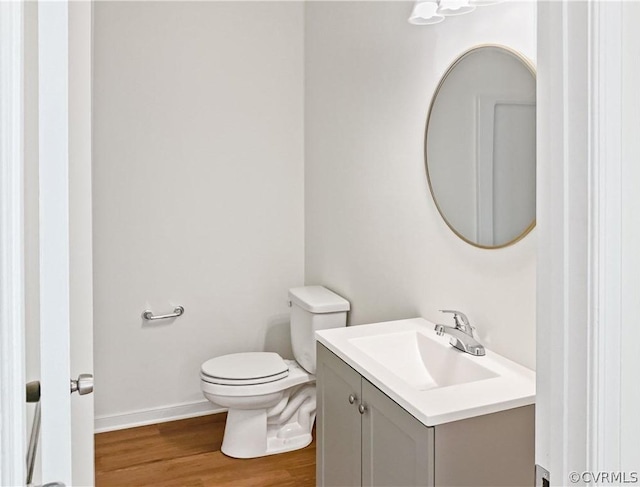 1608 Mechanicsville Tpke, Richmond, VA 23223 - bathroom with hardwood / wood-style floors, vanity, and toilet
