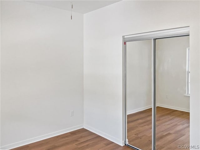 1608 Mechanicsville Tpke, Richmond, VA 23223 - unfurnished bedroom with a closet and hardwood / wood-style flooring