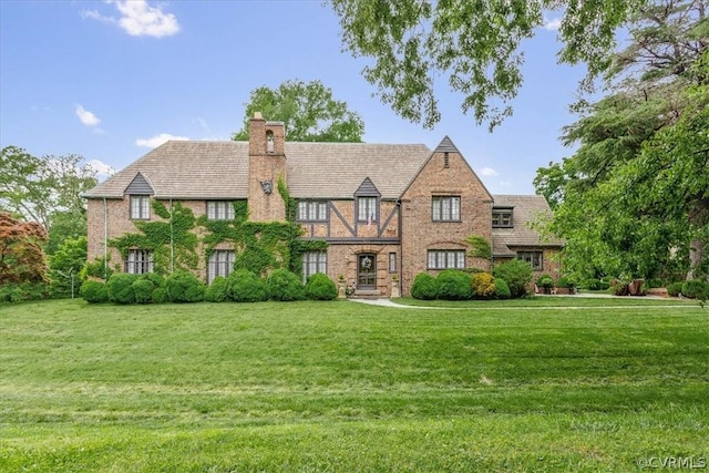 tudor house with a front yard