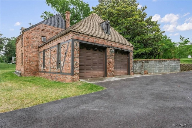 garage with a lawn