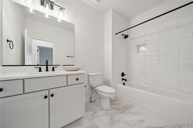 full bathroom featuring tiled shower / bath combo, vanity, and toilet