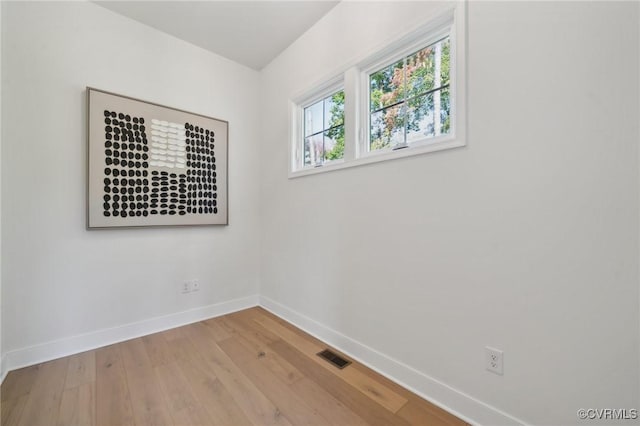 spare room featuring light wood-type flooring