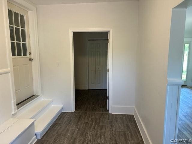 hallway with dark wood-type flooring