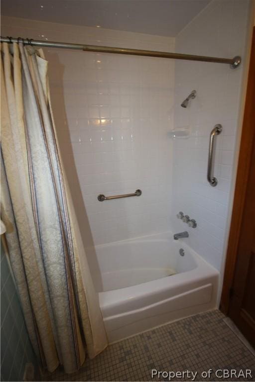 bathroom with tile patterned flooring and shower / tub combo with curtain