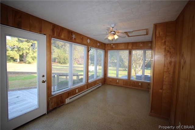 unfurnished sunroom with a baseboard heating unit and a ceiling fan