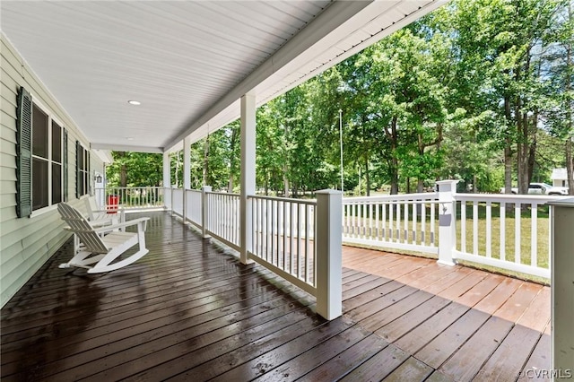 wooden deck featuring covered porch