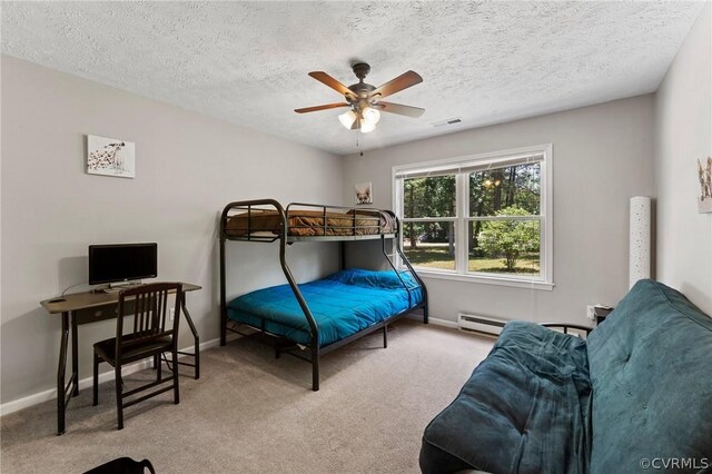 carpeted bedroom featuring a textured ceiling and ceiling fan