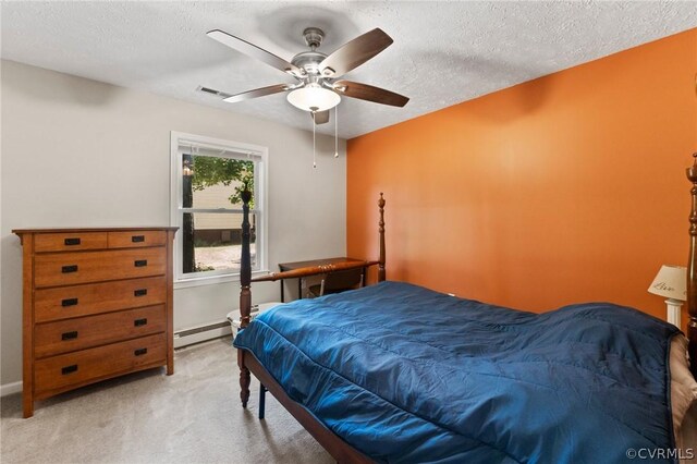 bedroom with light carpet, a baseboard radiator, a textured ceiling, and ceiling fan