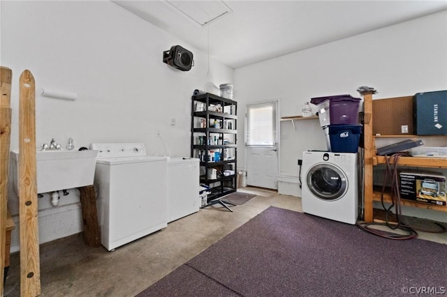 laundry room with separate washer and dryer and sink