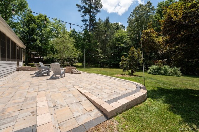 view of patio featuring an outdoor fire pit