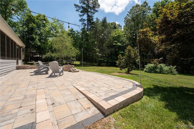 view of patio featuring a fire pit