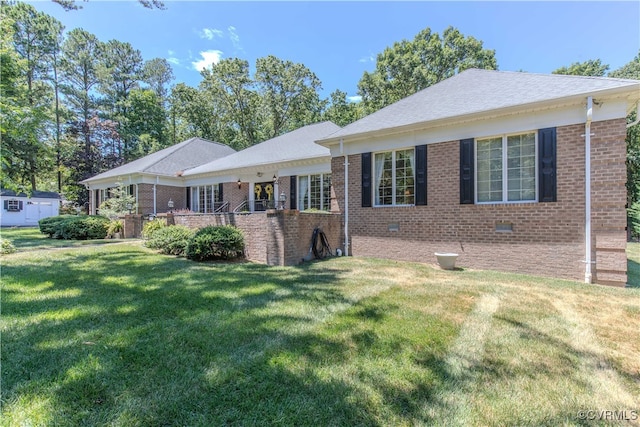 single story home with brick siding, crawl space, and a front yard