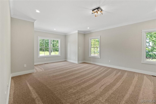 carpeted empty room featuring recessed lighting, baseboards, and ornamental molding