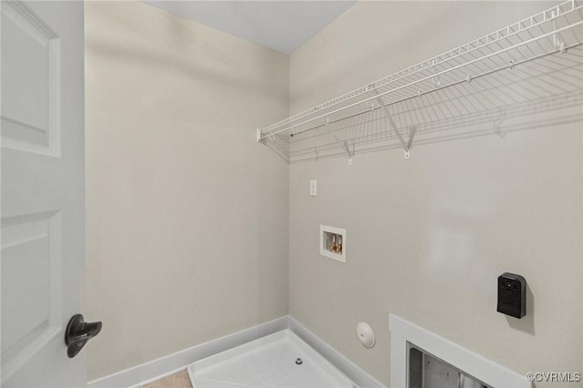 laundry room with baseboards, gas dryer hookup, washer hookup, and laundry area