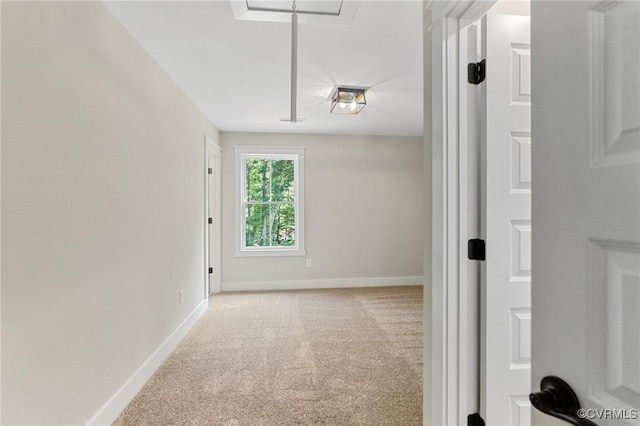 interior space with baseboards and carpet floors