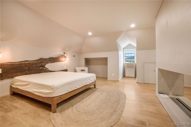 bedroom with recessed lighting, baseboards, lofted ceiling, and light wood-style flooring