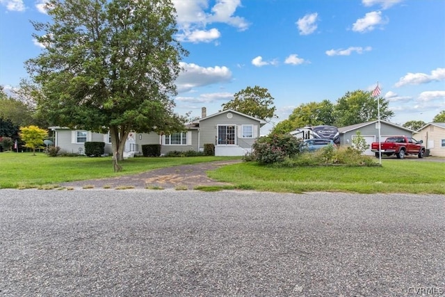 view of front of property with a front lawn