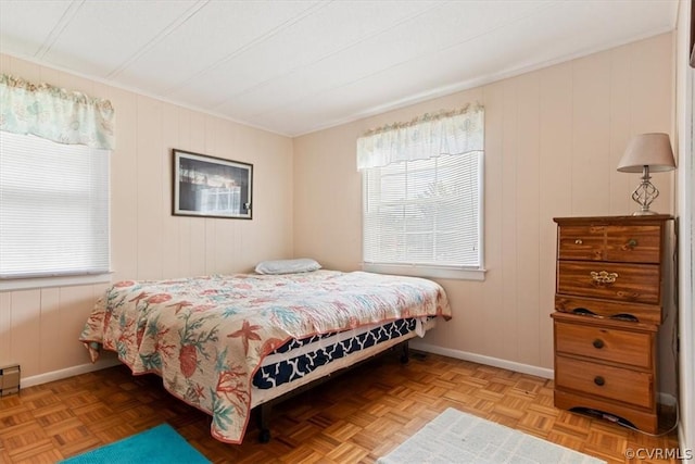 bedroom with light parquet flooring