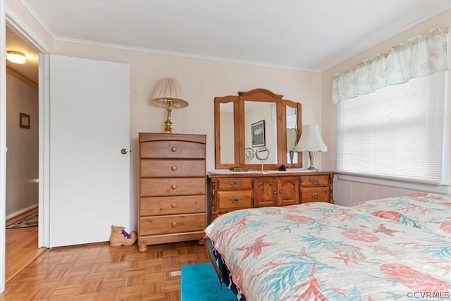 bedroom featuring crown molding and light parquet floors