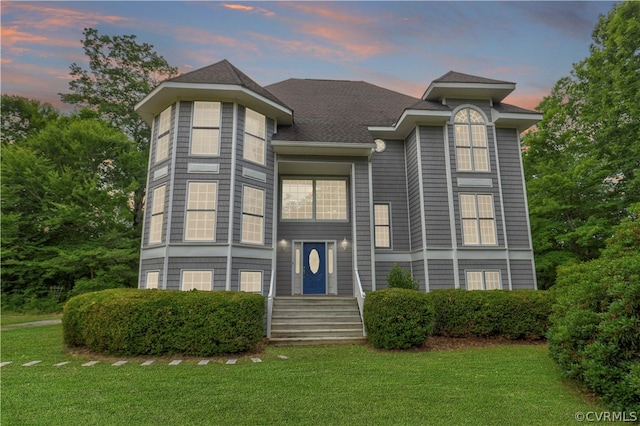 view of front of home with a lawn