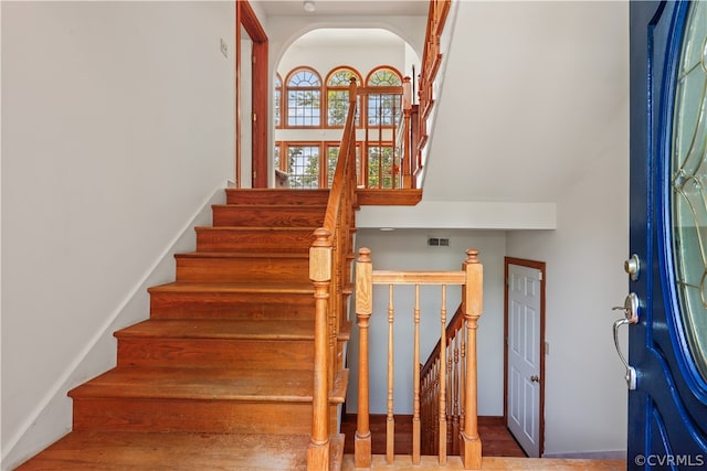 stairway featuring wood-type flooring