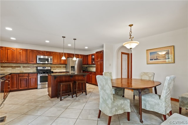 dining space featuring light tile patterned floors