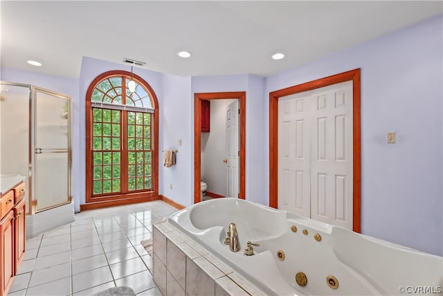 full bathroom with tile patterned flooring, toilet, independent shower and bath, and vanity