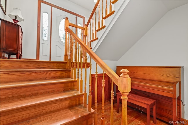 stairs with wood-type flooring