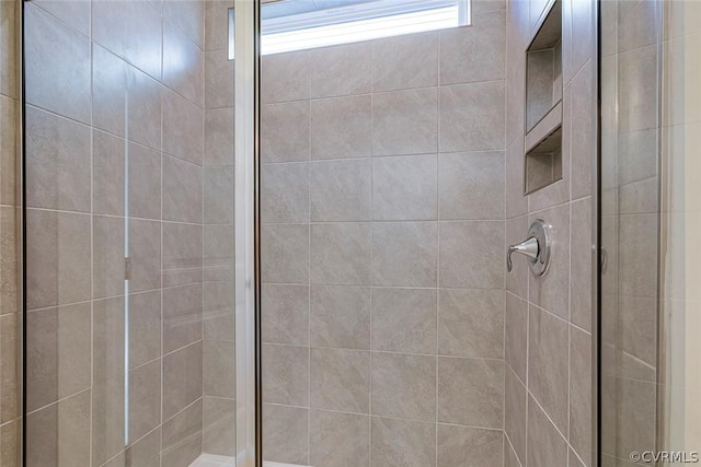 bathroom with a tile shower