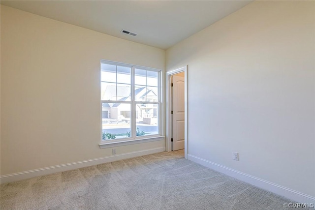 empty room featuring light colored carpet