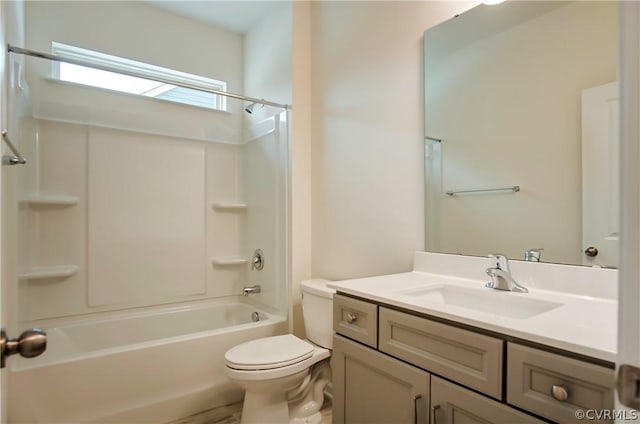 full bathroom featuring vanity, washtub / shower combination, and toilet